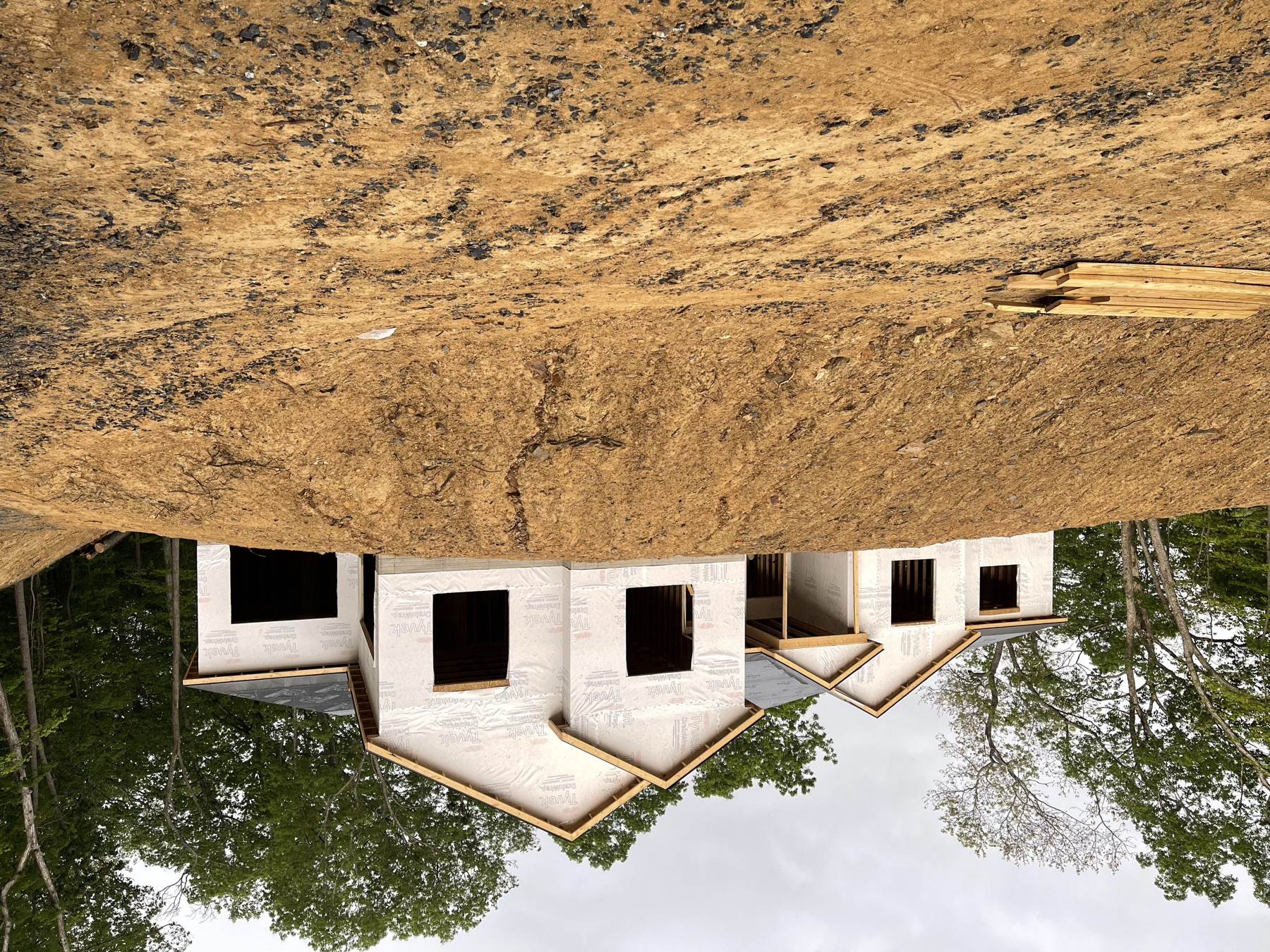 Large custom hillside home wrapped and weatherproofed during construction